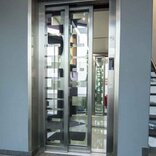 Elevator doors adorned with signage vinyl, displaying important information or promotional messages, adding visual interest and functionality to the space.