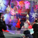 A storefront window creatively decorated using signage vinyl, featuring captivating designs or promotional graphics to attract attention and enhance the visual appeal of the shop.