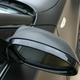closeup om car mirror wrapped in carbon fiber vinyl