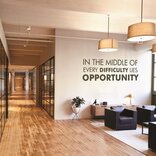 An office wall adorned with decorative elements created using signage vinyl, adding a modern and stylish touch to the workspace ambiance.
