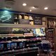 A shop wall adorned with blackboard-style signage vinyl decor, featuring artistic designs or informative messages, adding charm and functionality to the retail space.