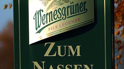 ORACAL® 301F/351/352 Polyester Film A beer sign crafted with signage vinyl, showcasing bold graphics, brand logos, and enticing messages, serving as a prominent focal point in a bar or brewery setting.